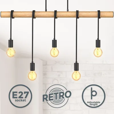 A close-up shot of a wooden light fixture with five pendant lights.