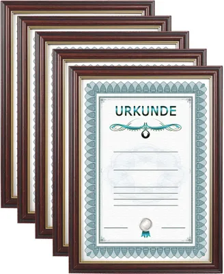 A stack of framed certificates or documents, with one frame in the foreground showing the word 'URKUNDE'.