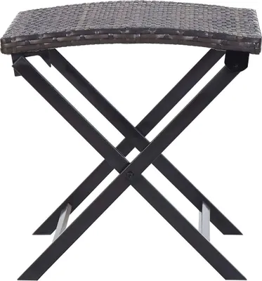 A close-up view of a folding table with a woven top and black metal legs.