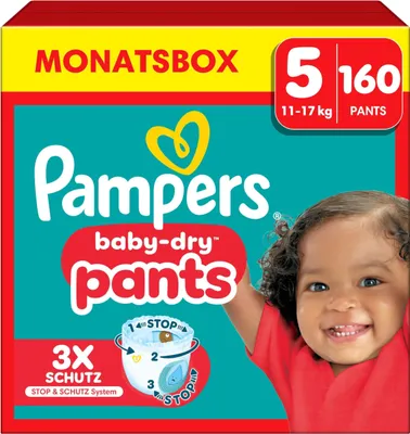 A box of Pampers baby-dry pants with a smiling baby on the front.