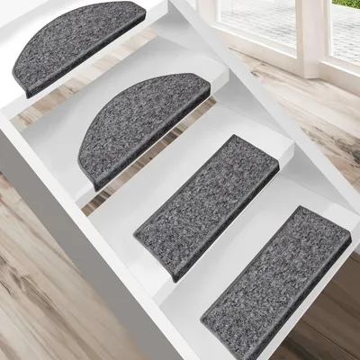 Stair treads on white stairs with a window in the background.