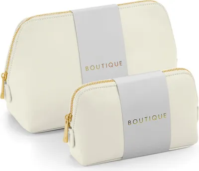 Two cream-colored cosmetic bags with gold lettering are shown against a white background.