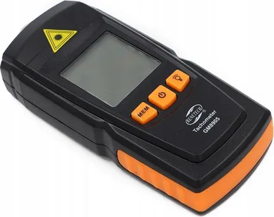 A black and orange tachometer with a digital display and buttons.