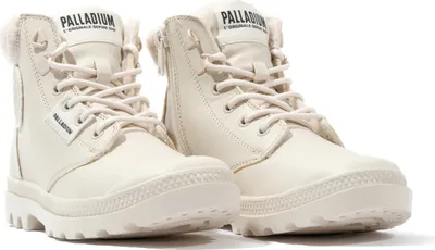 A pair of cream-colored Palladium boots.
