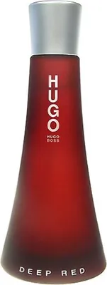 A studio shot of a red perfume bottle.
