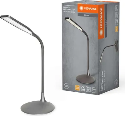 A desk lamp and its packaging are shown side-by-side.