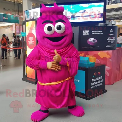 Productafbeelding van Magenta Biryani mascotte REDBROKOLY kostuum karakter gekleed met een cover-up en smartwatches