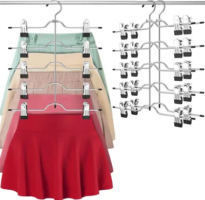 A set of multi-tiered hangers for skirts and pants, with several garments already attached.