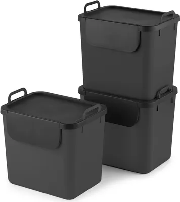 Three black trash bins are stacked and arranged in a studio setting against a white background.