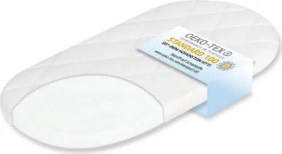 A white mattress with a quilted top and a cutaway showing the foam interior, with a certification tag attached.