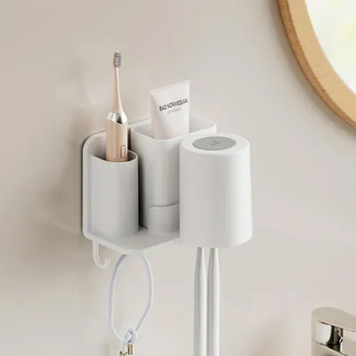 Immagine prodotto di Portaspazzolini da parete con 1 bicchiere e vano portaoggetti, senza necessità di foratura, in plastica