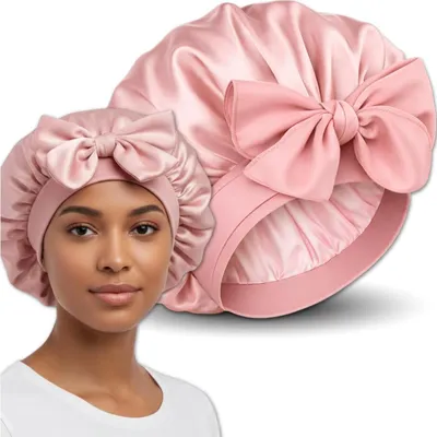 Produktbild von EDIBAZZAR | Schlafhaube aus Satin in Rosa mit Bändern zum Schutz