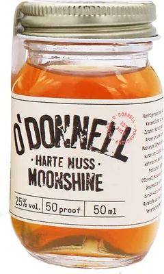 A small glass jar of O'Donnell Moonshine with a label.
