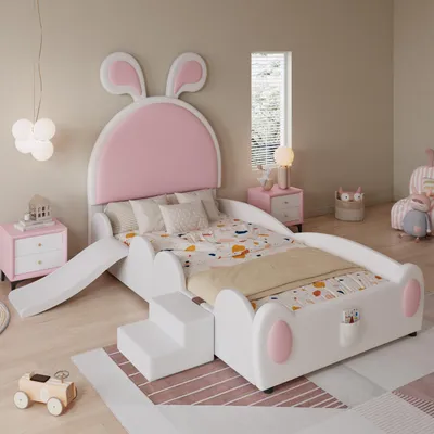 A child's bed with a bunny theme, featuring a slide and stairs, in a bedroom setting.