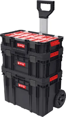 A stack of three black toolboxes with red lids and latches, on wheels, with a retractable handle extended.