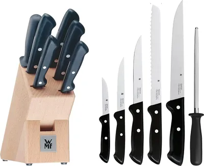 A set of knives in a wooden block and a separate set of knives with a sharpening steel.