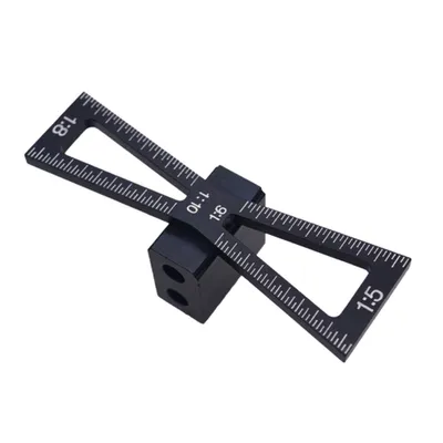 A black woodworking dovetail marker is shown on a white background.