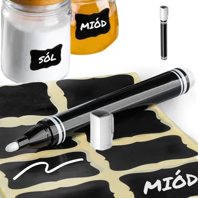 A close-up shot of a chalk marker and labels, with jars of salt and honey in the background.