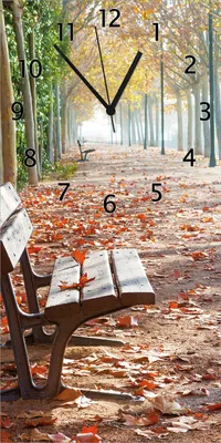 Produktbild von Wallario Design Wanduhr bedruckt, Größe 30 x 60 cm, Motiv: Einsame Parkbank an einer Allee - Herbststimmung