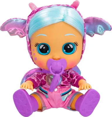 A doll dressed in a fantasy costume, sitting down.