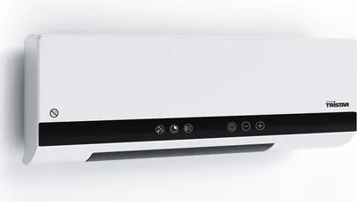 A white ceramic heater mounted on a white wall.