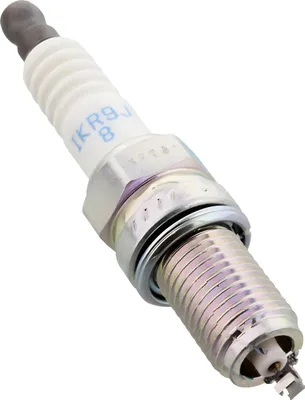 A close-up studio shot of a spark plug against a white background.
