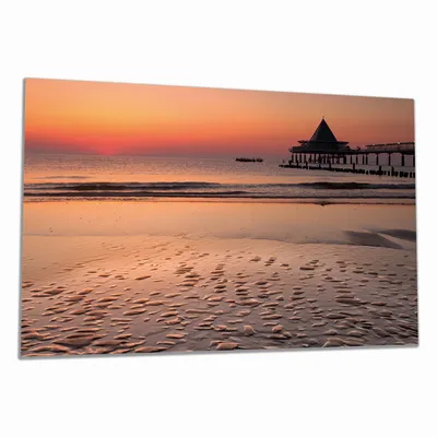 Produktbild von Wallario Herdabdeckplatte aus Glas, Größe 90 x 52 cm 1-teilig, Motiv Strand am Abend - Seebrücke am Ostseebad Heringsdorf