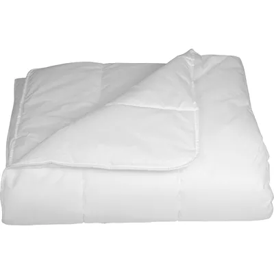A white duvet is folded and lying on a white background.