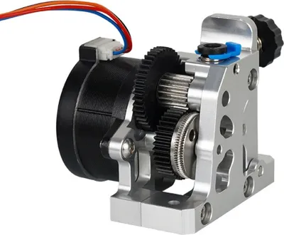 A close-up, studio shot of a 3D printer extruder mechanism.