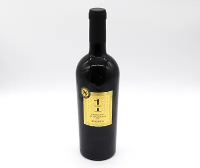 A bottle of red wine against a white background.