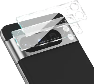A close-up view of two clear glass camera lens protectors being placed on the camera module of a smartphone.