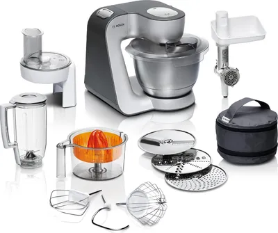 A collection of kitchen appliance attachments and a food processor base are displayed against a white background.