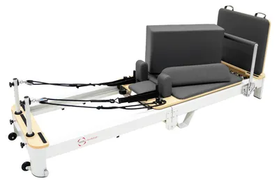 Immagine prodotto di Macchina pieghevole per Pilates, realizzata in alluminio, parzialmente assemblata, con piattaforma allargata, supporto e pedana