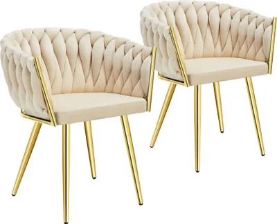 Two beige upholstered chairs with gold metal legs are shown against a white background.