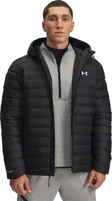A man wearing a black puffer jacket over a gray hoodie.