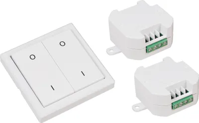 A white dual-gang light switch and two white wireless receivers are arranged on a white background.