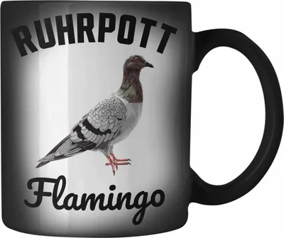 Produktbild von Trendation - Taubenzüchter Geschenk Zaubenzucht Zubehör Tauben Farbwechsel Zauber-Tasse Lustiger Spruch Taubenflüsterer Becher Ruhrpott Flamingo (Schwarz)