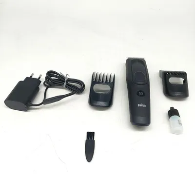 A collection of Braun hair trimmer accessories laid out on a white background.