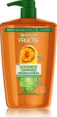 A bottle of Garnier Fructis shampoo with a pump dispenser.