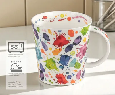 A colorful mug with paint splatters on a countertop.
