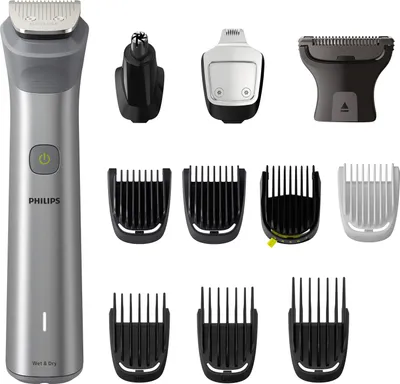 A collection of grooming tools and attachments, including a main trimmer and various comb attachments, displayed against a white background.