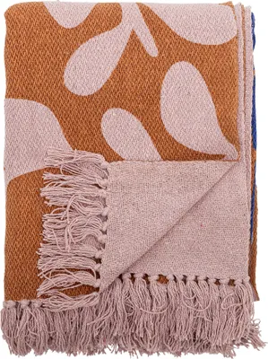 A folded blanket with a patterned design and fringe.