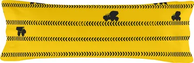 A yellow pillowcase with a construction vehicle pattern.