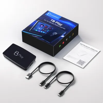 A product shot of a car adapter and its packaging, along with cables and instructions, arranged on a neutral surface.