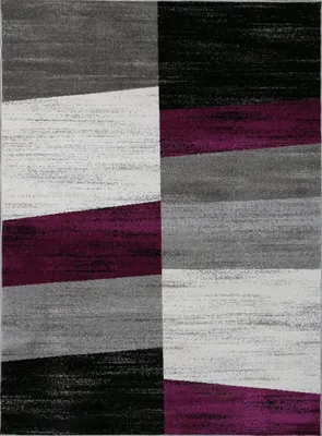 A geometric patterned rug with alternating blocks of color.