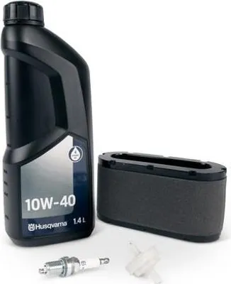 A kit of maintenance items for a Husqvarna engine, including oil, an air filter, and a spark plug.