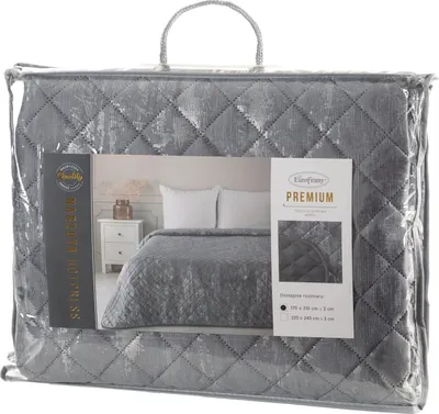 A quilted blanket is shown inside its clear plastic packaging.