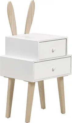 A white bedside table with two drawers and wooden legs, featuring decorative wooden bunny ears on top.
