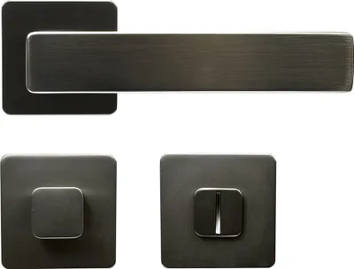 A set of door hardware, including a door handle, a WC lock mechanism, and a keyhole cover, displayed against a white background.