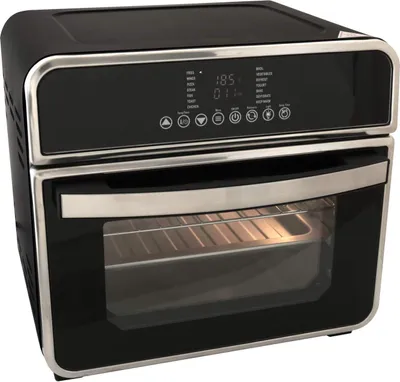 A black air fryer oven with silver accents sits on a black surface.